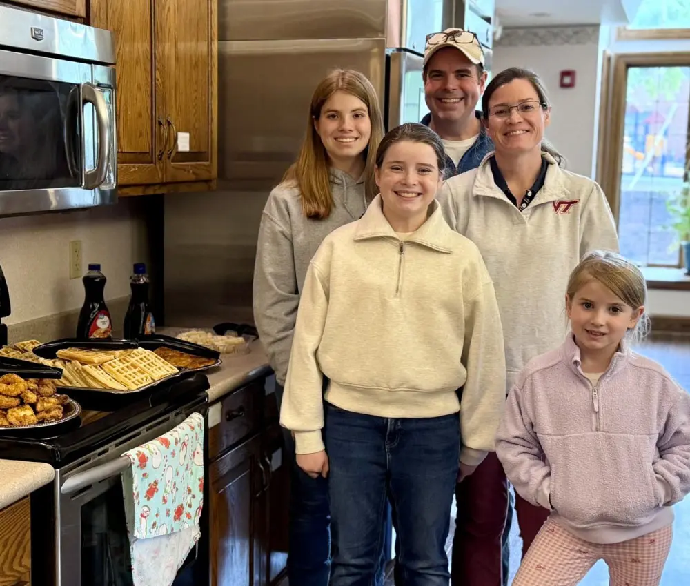 Family gathered by provided breakfast meal