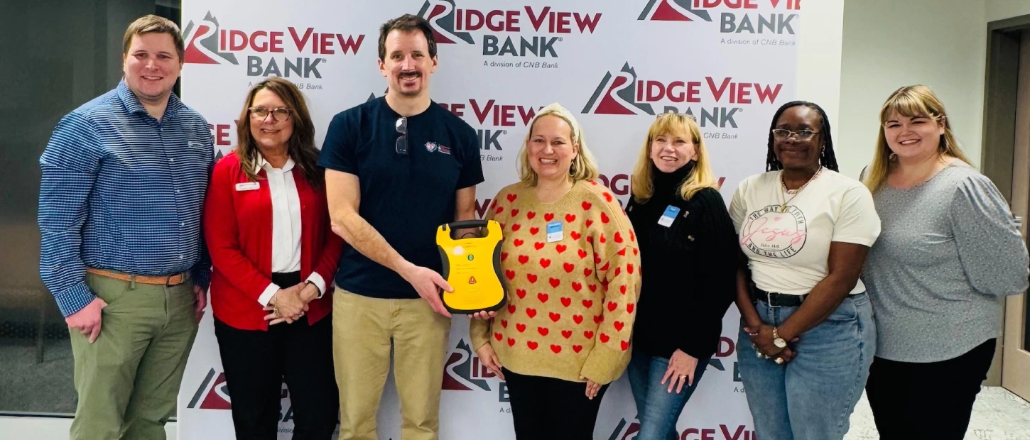 corporate partners presenting a donation