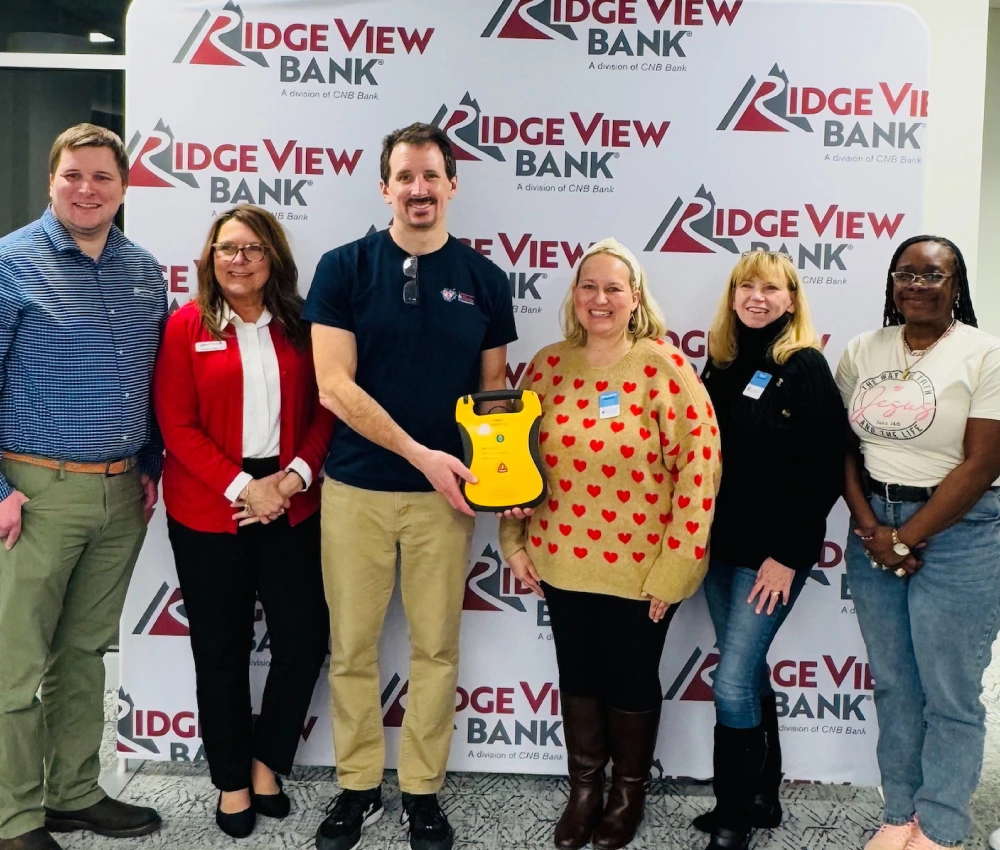corporate partners presenting a donation