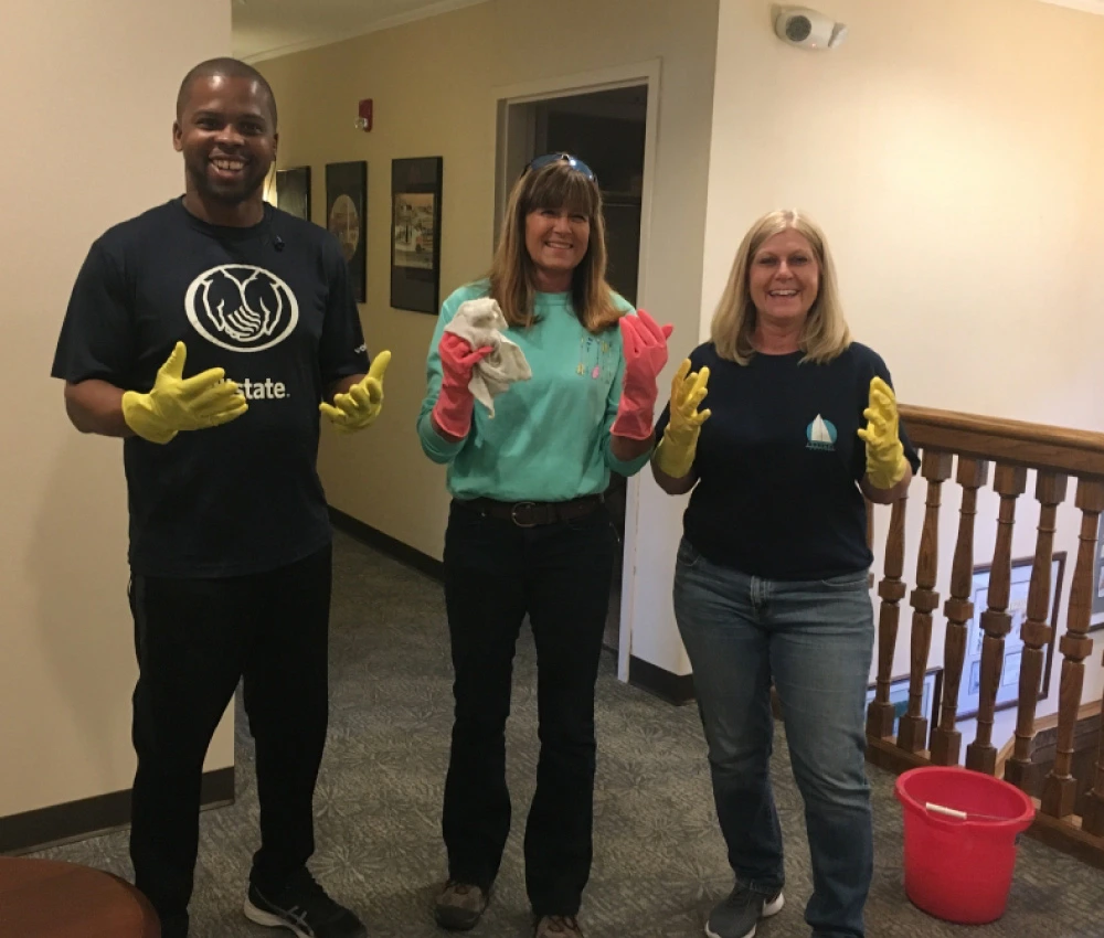 three of our house companions wearing cleaning gloves