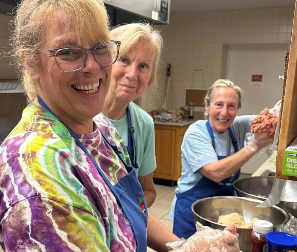 volunteers preparing a meal